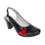 Pantofi eleganți de damă, tip slingback, cu toc gros stabil și design modern în combinație negru-roșu. Ideali pentru ținute office sau casual.